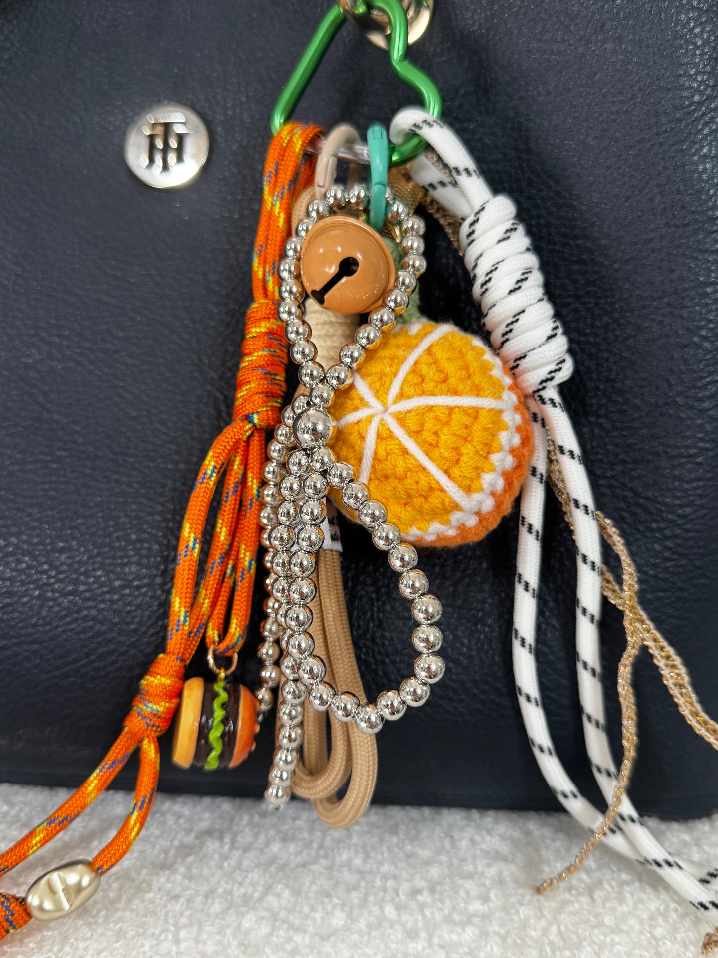 Grigri pour sac orange et vert
